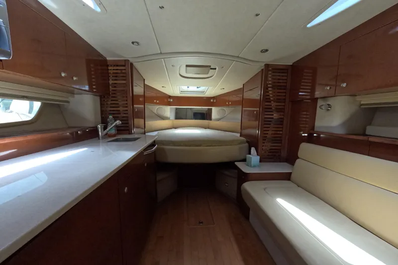 Slide: The Image of Luxurious interior of a 2008 Sea Ray Sundancer 350 yacht with elegant wood finishes. - 2