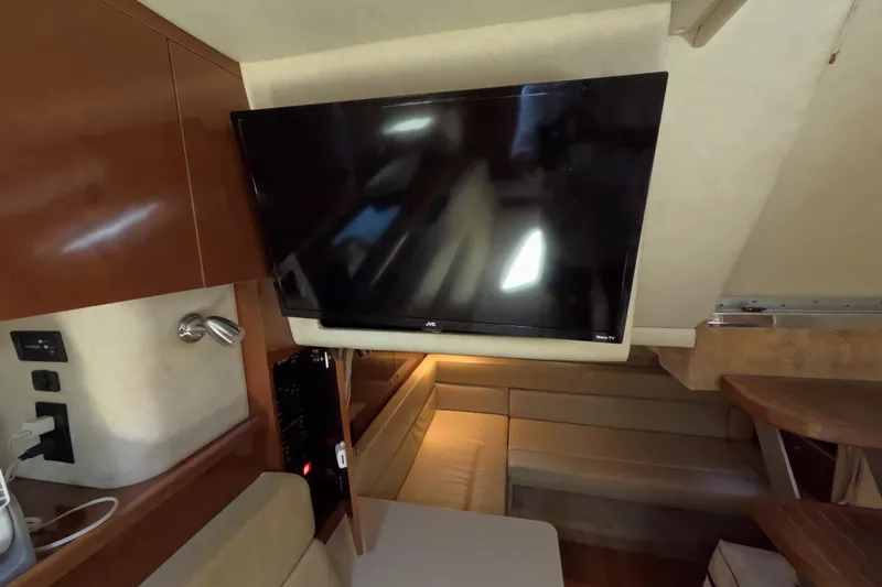 Slide: The Image of Interior of 2008 Sea Ray Sundancer 350 with mounted JVC TV and seating area. - 19
