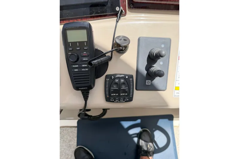 Slide: The Image of Control panel of a 2008 Sea Ray Sundancer 350 with Garmin radio and joystick controls. - 35