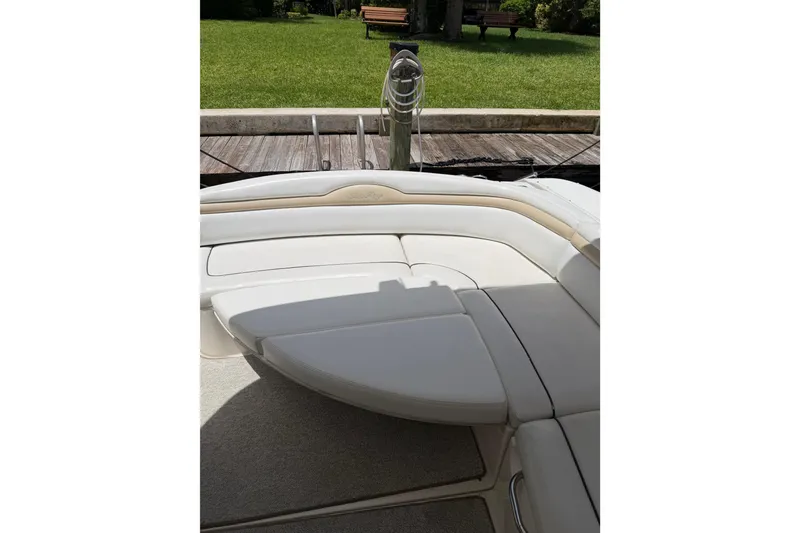 Slide: The Image of 2008 Sea Ray Sundancer 350 boat interior with cushioned seating and outdoor view. - 39