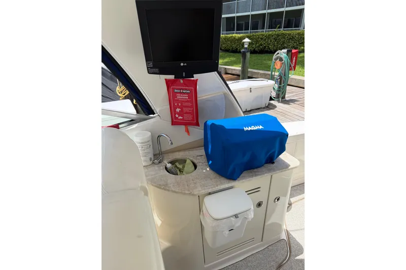 Slide: The Image of Outdoor kitchenette on 2008 Sea Ray Sundancer 350 yacht with TV and covered grill. - 38
