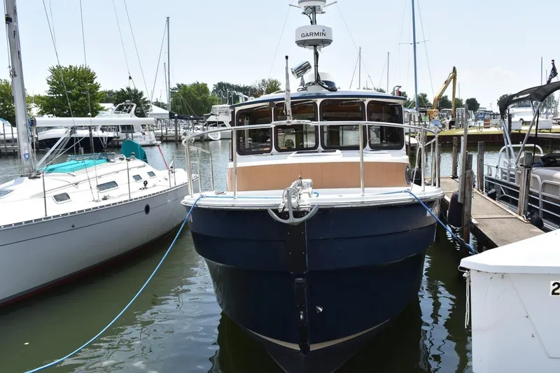 The Image of 2013 Ranger Tugs R-29 docked at a marina, front view. - 0