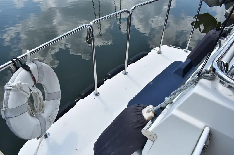 Slide: The Image of 2013 Ranger Tugs R-29 boat deck with life preserver and calm water reflection. - 15