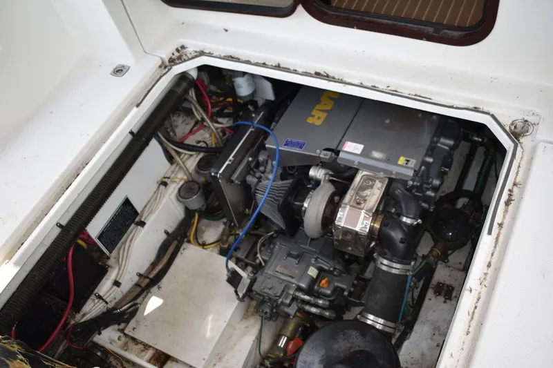 Slide: The Image of Engine compartment of a 2013 Ranger Tugs R-29 boat, showcasing mechanical components. - 41