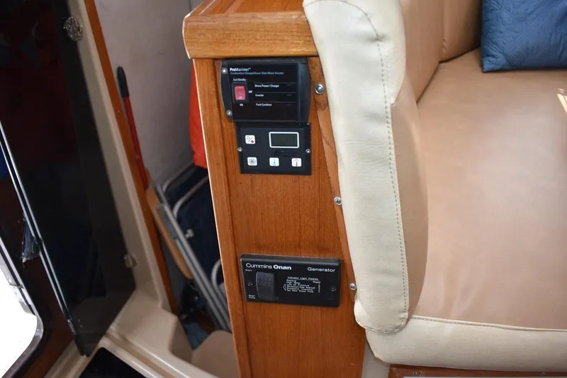 Slide: The Image of Control panel on 2013 Ranger Tugs R-29 boat, featuring Cummins Onan generator. - 42