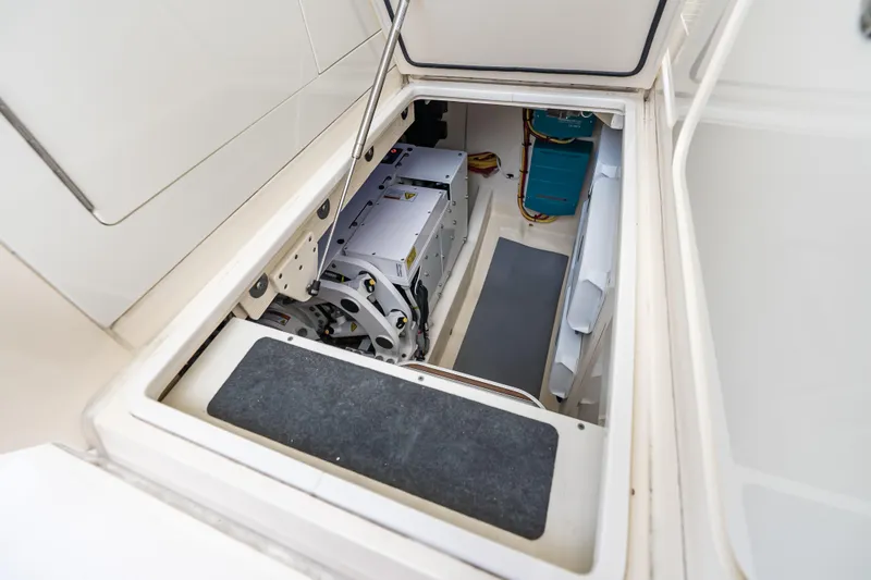 Slide: The Image of Engine compartment of 2024 Scout 425 LXF boat, showcasing advanced machinery and storage space. - 21