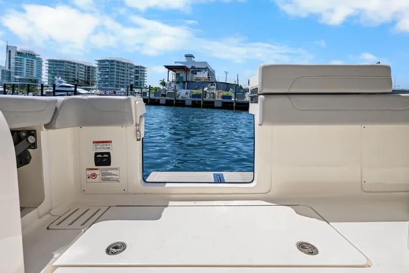 Slide: The Image of 2024 Scout 425 LXF boat interior with marina view, featuring modern design and spacious layout. - 42