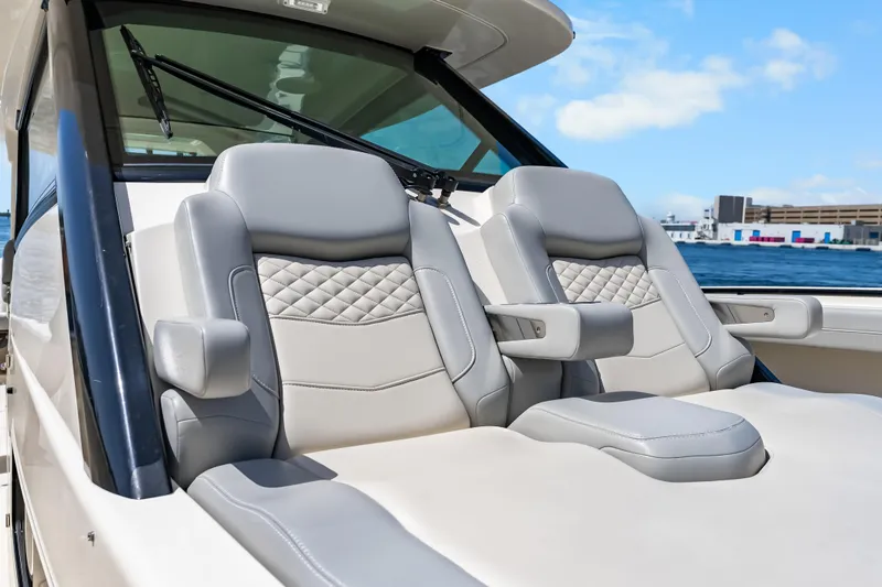 Slide: The Image of Luxurious seating on 2024 Scout 425 LXF boat with ocean backdrop. - 29