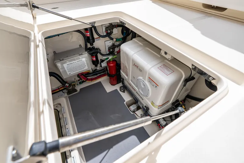 Slide: The Image of Engine compartment of 2024 Scout 425 LXF boat, showcasing mechanical components and wiring. - 19