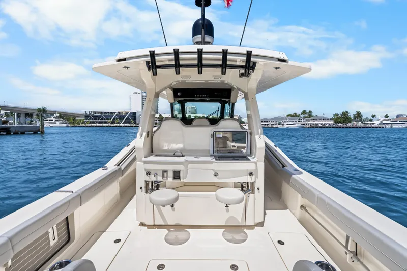 Slide: The Image of 2024 Scout 425 LXF boat interior with seating and ocean view. - 40