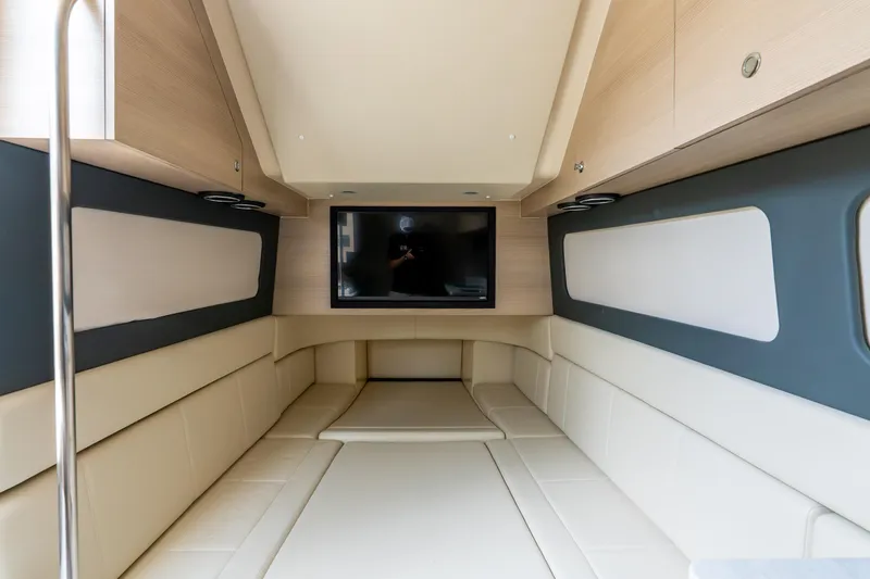 Slide: The Image of Luxurious interior cabin of 2024 Scout 425 LXF boat with modern seating and TV. - 49