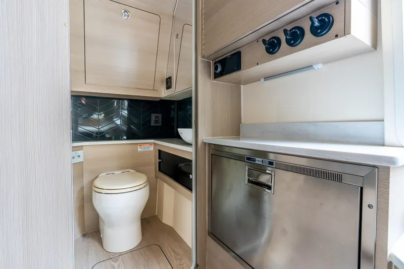 Slide: The Image of 2024 Scout 425 LXF interior bathroom with modern fixtures and sleek cabinetry. - 51