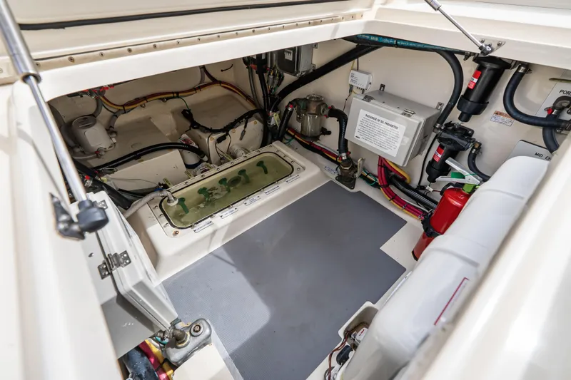 Slide: The Image of Engine compartment of 2024 Scout 425 LXF boat, showcasing wiring and equipment layout. - 20