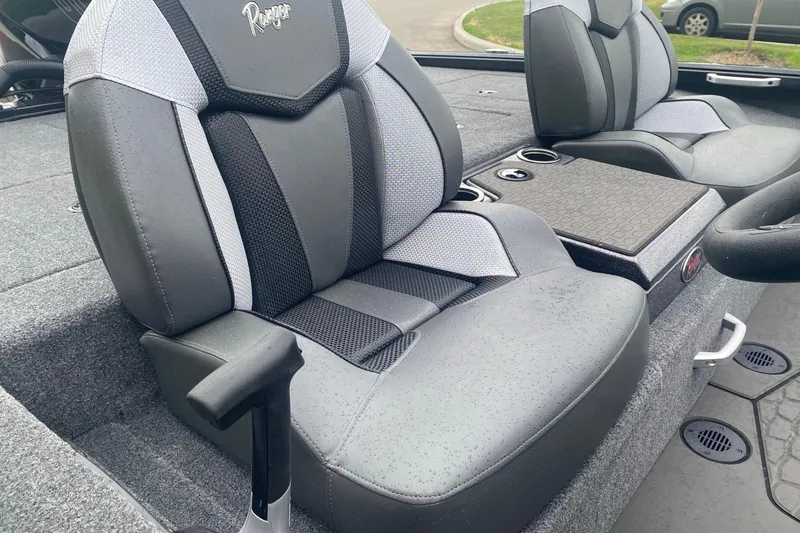 Slide: The Image of 2026 Ranger ALPHA 208 boat seats with sleek design and cup holders. - 6
