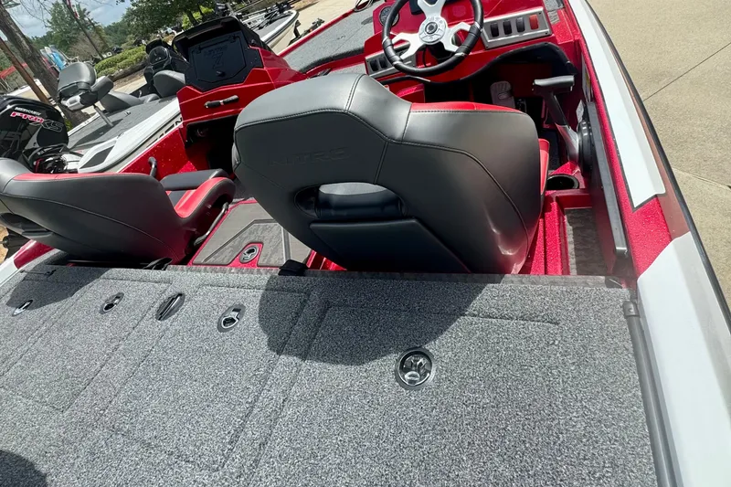Slide: The Image of 2026 Nitro Z19 XL Pro boat interior with red accents and modern seating design. - 1