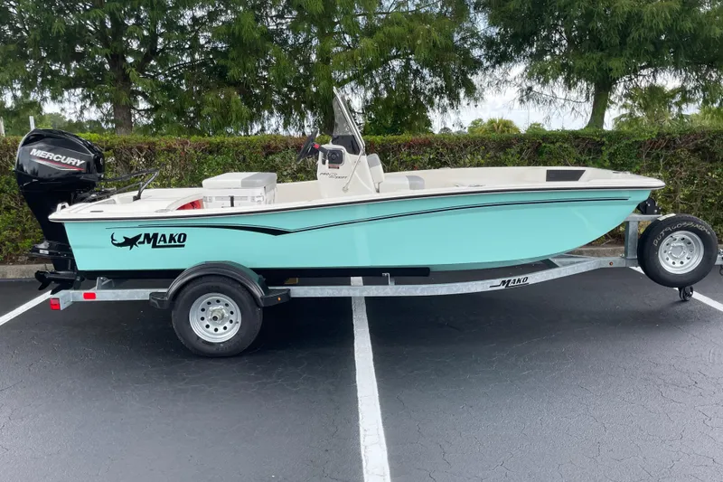 The Image of 2026 Mako Pro Skiff 15 CC boat on trailer, parked outdoors. - 0