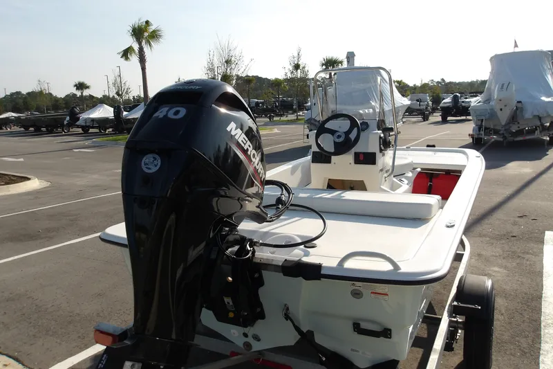 Slide: The Image of 2026 Mako Pro Skiff 13 CC boat with Mercury 40 engine in parking lot. - 17