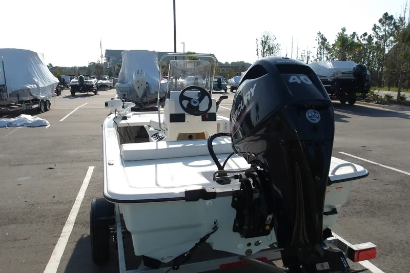 Slide: The Image of 2026 Mako Pro Skiff 13 CC with Mercury 40 engine in a parking lot. - 16