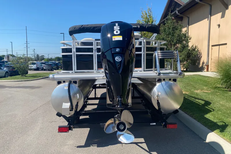 Slide: The Image of 2026 Sun Tracker Fishin' Barge 22 DLX pontoon boat with powerful outboard motor. - 10