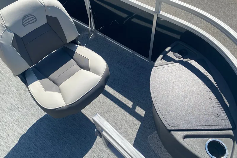 Slide: The Image of 2026 Sun Tracker Fishin' Barge 22 DLX boat seat and fishing station detail. - 5