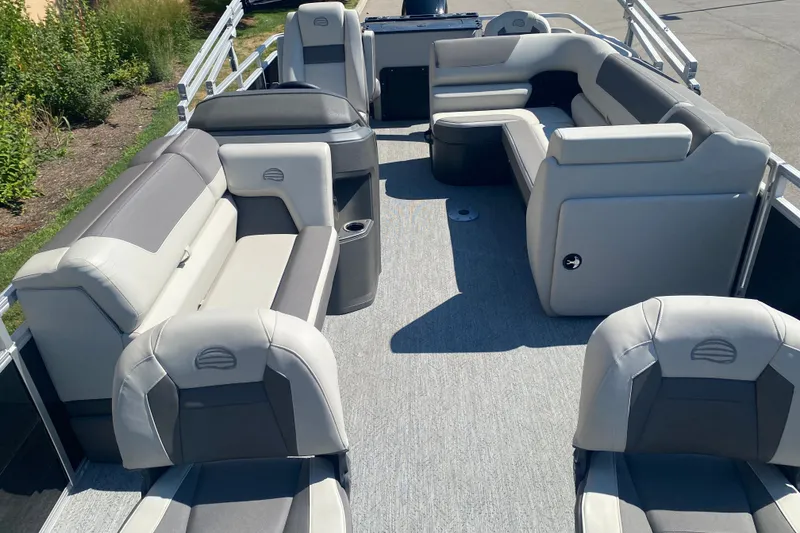 Slide: The Image of 2026 Sun Tracker Fishin' Barge 22 DLX interior with spacious seating and modern design. - 9