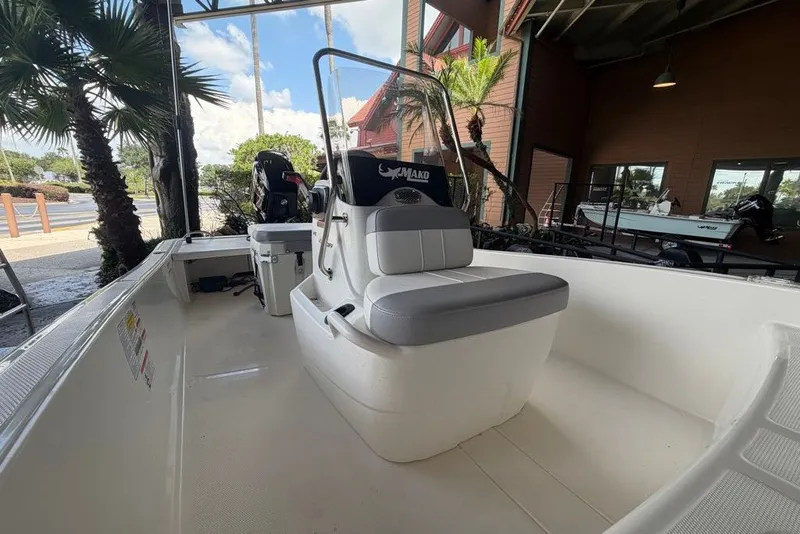 Slide: The Image of 2026 Mako Pro Skiff 15 CC boat interior with seating and console. - 4