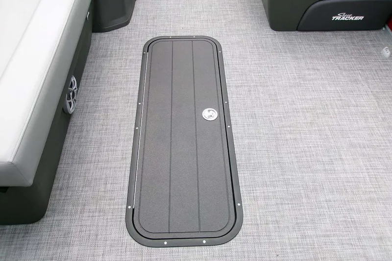 Slide: The Image of Interior view of 2026 Sun Tracker Sportfish 24 XP3 boat with storage compartment. - 17