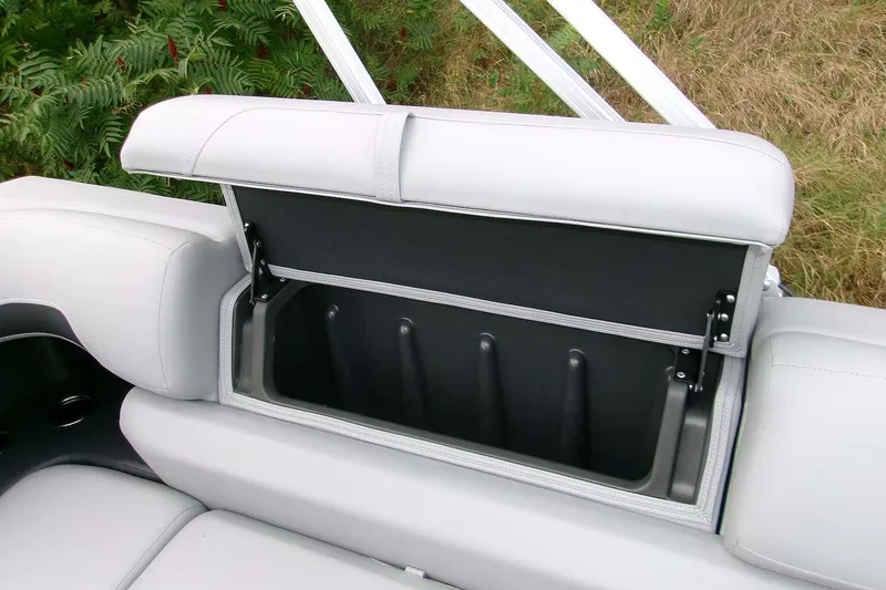 Slide: The Image of Sun Tracker Sportfish 24 XP3 2026 boat seat storage compartment, open with visible interior. - 14