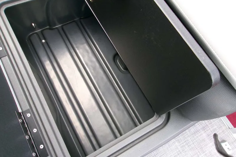 Slide: The Image of Storage compartment of 2026 Sun Tracker Sportfish 24 XP3 boat, open and empty. - 16