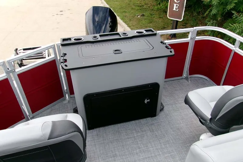 Slide: The Image of 2026 Sun Tracker Sportfish 24 XP3 boat interior with seating and control panel. - 18