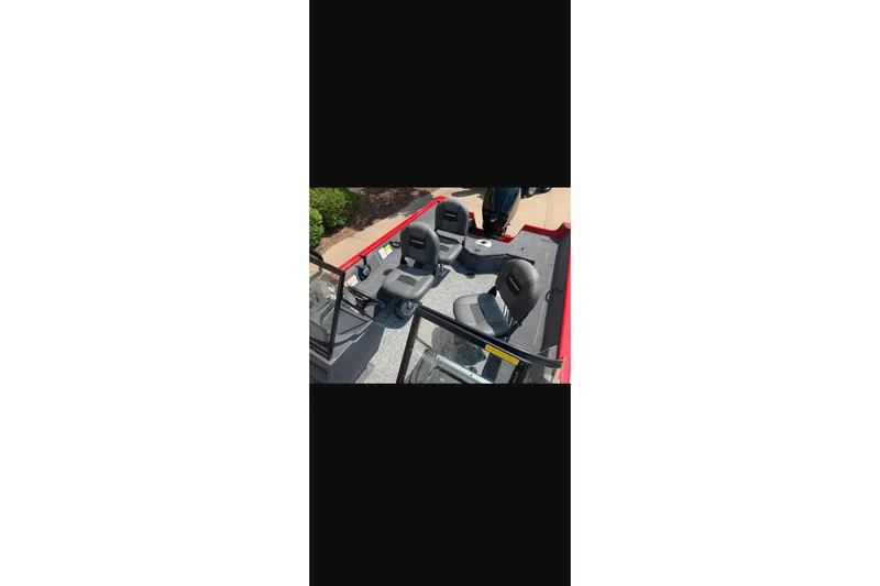 Slide: The Image of 2026 Tracker Pro Guide V-16 WT boat interior with seating and console. - 17