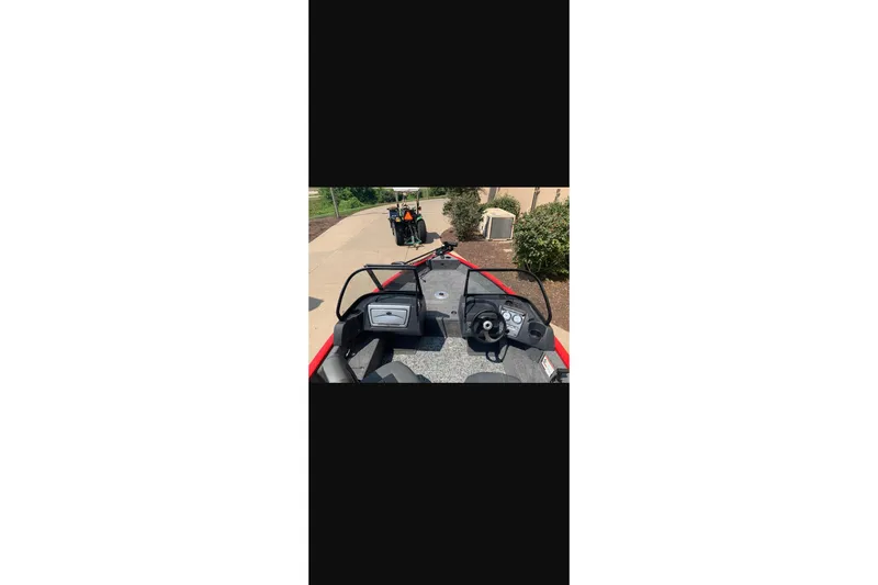 Slide: The Image of 2026 Tracker Pro Guide V-16 WT boat interior with steering wheel and dashboard. - 19