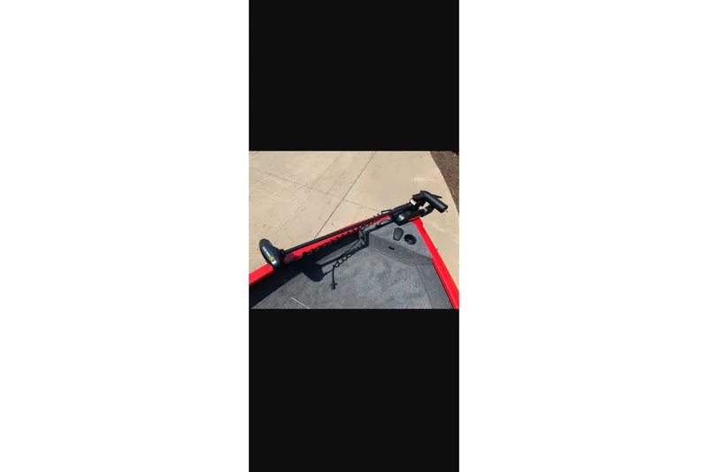 Slide: The Image of 2026 Tracker Pro Guide V-16 WT boat with mounted trolling motor on deck. - 14