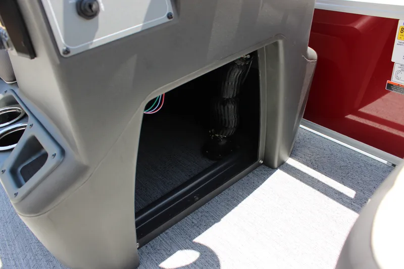 Slide: The Image of Interior view of 2026 Sun Tracker Bass Buggy 18 DLX boat console area. - 13