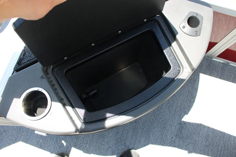 Slide: The Image of Open storage compartment on 2026 Sun Tracker Bass Buggy 18 DLX boat. - 14