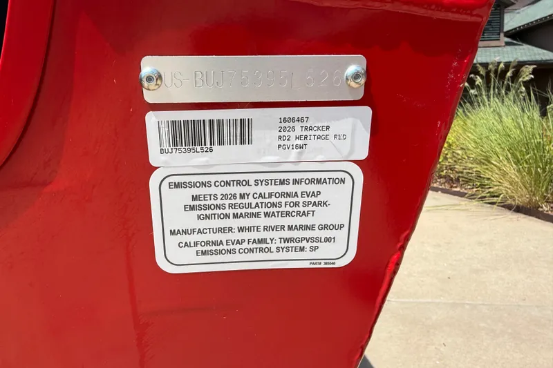 Slide: The Image of Red 2026 Tracker Pro Guide V-16 WT boat with emissions control information label. - 25
