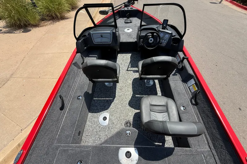 Slide: The Image of 2026 Tracker Pro Guide V-16 WT boat interior with dual seats and steering console. - 19