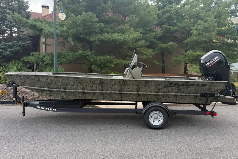 The Image of 2026 Tracker Grizzly 2072 CC boat on trailer, parked outdoors. - 0