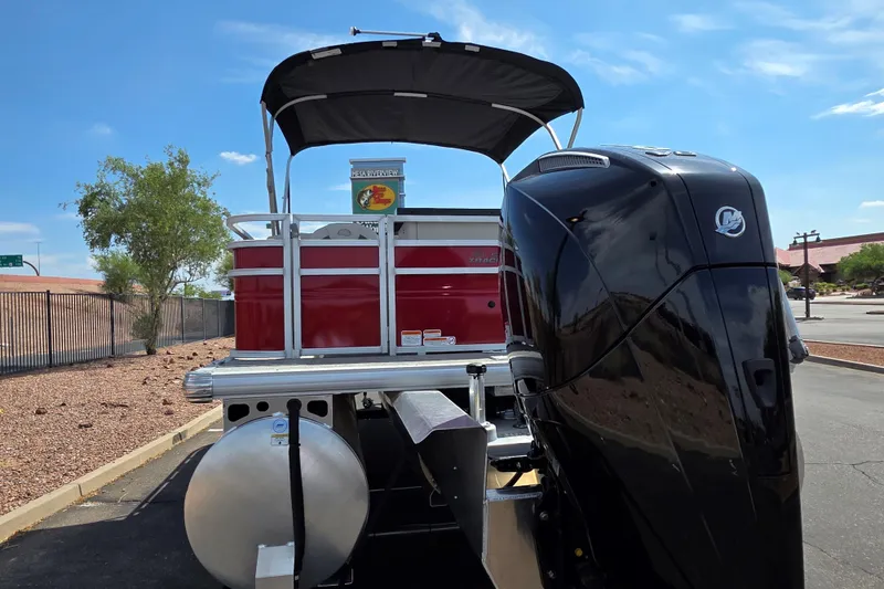Slide: The Image of 2026 Sun Tracker Fishin' Barge 22 XP3 pontoon boat with powerful outboard motor. - 3