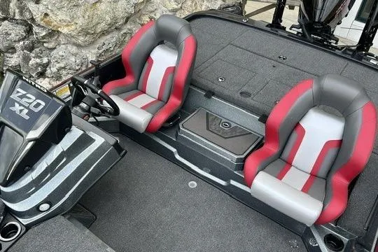 Slide: The Image of 2026 Nitro Z20 XL Pro boat interior with red and gray seats, steering console. - 4