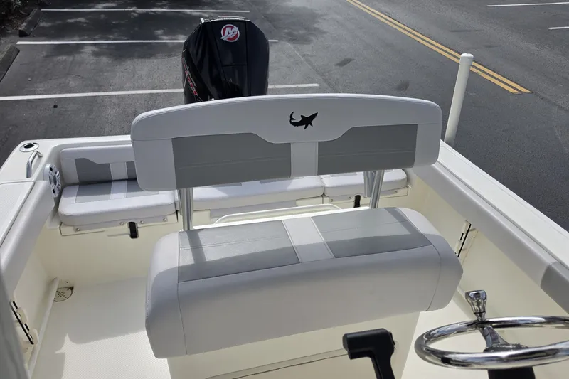 Slide: The Image of 2024 Mako 214 Center Console boat interior with seating and steering wheel. - 14