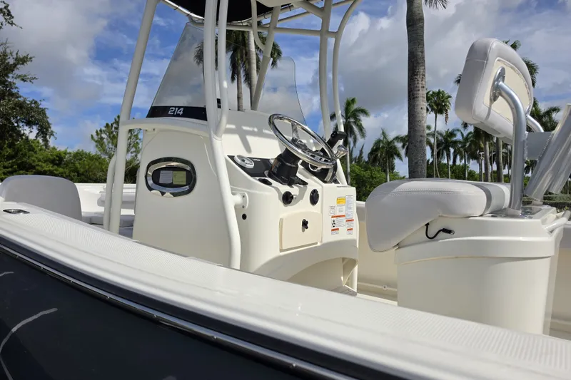 Slide: The Image of 2024 Mako 214 Center Console boat with sleek design and modern controls. - 4