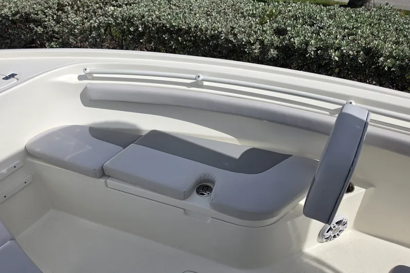 Slide: The Image of 2024 Mako 214 Center Console boat interior with cushioned seating and speaker. - 15