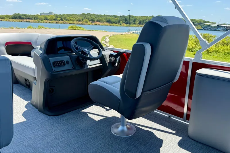 Slide: The Image of Interior of 2026 Sun Tracker Party Barge 22 RF DLX with steering console and seating. - 12