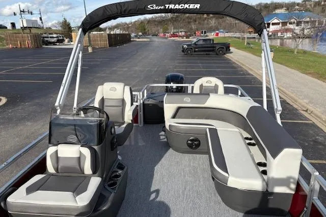 Slide: The Image of 2026 Sun Tracker Bass Buggy 18 DLX pontoon boat with spacious seating and modern design. - 18