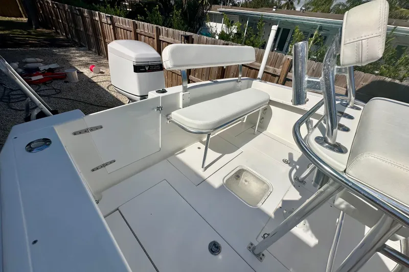 Slide: The Image of 2001 Contender 23 Open boat interior with seating and engine view. - 39