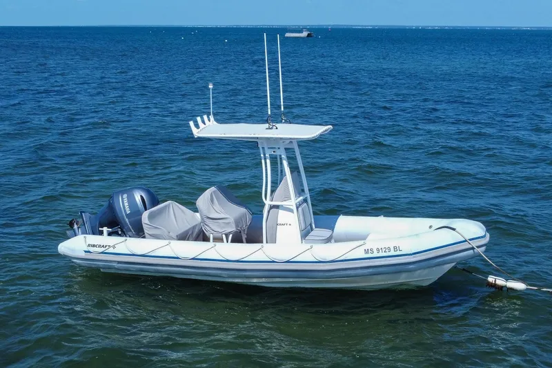 Slide: The Image of 2019 Ribcraft 6.8 boat with Yamaha engine on calm blue water. - 4