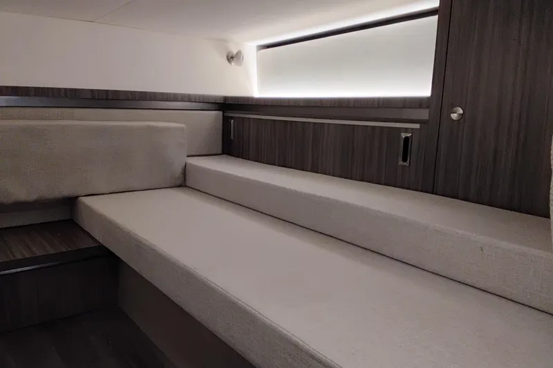 Slide: The Image of Interior cabin of 2023 Sea Ray Sundancer 320 Outboard, featuring sleek, modern design. - 34