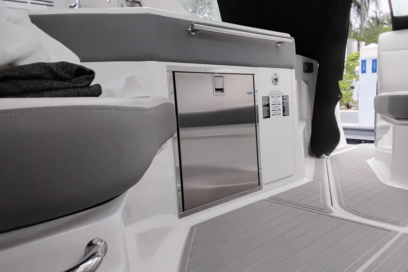 Slide: The Image of 2023 Sea Ray Sundancer 320 Outboard interior with sleek seating and stainless steel features. - 13