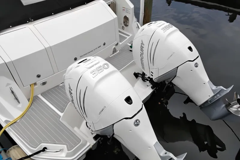Slide: The Image of 2023 Sea Ray Sundancer 320 Outboard with twin Mercury 350 engines at dock. - 40